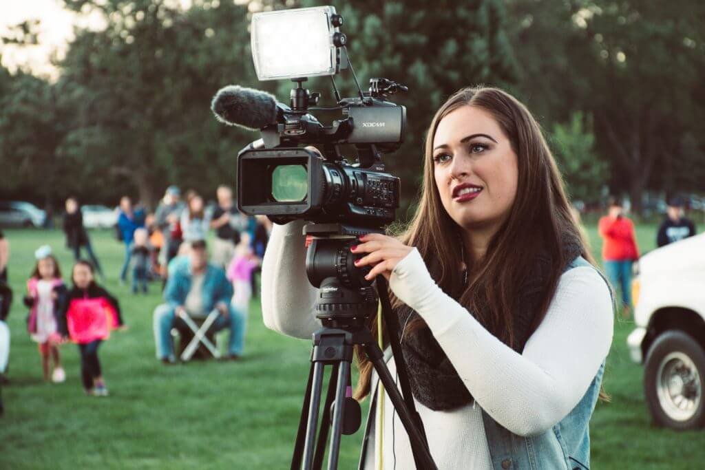 selective-focus-photo-of-a-woman-using-video-camera-1408984-1024x683